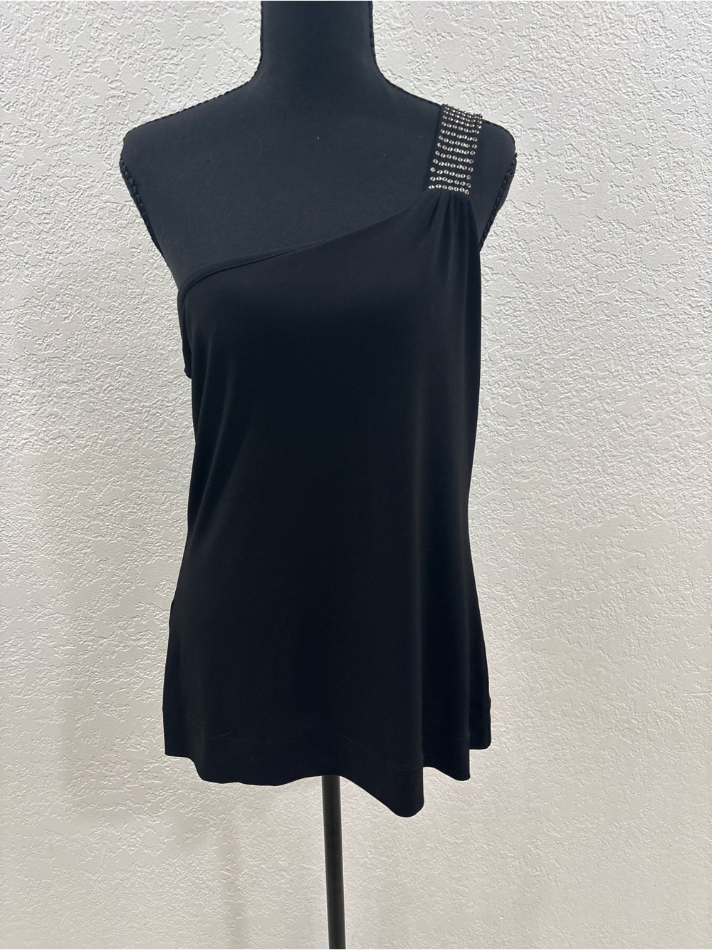 Express one-shoulder top with sequin accents.